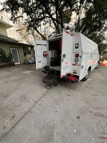 Magnet Plumbing service vehicle on-site for Grease Trap Cleaning in Country Creek